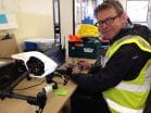 Nick director downloading footage whilst sat with our dji inspire aircraft, drone