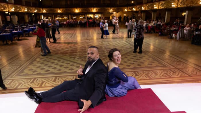 Rosie Jones and Guz Khan both comedians filming on Trip Hazard take a dance in the Tower Ballroom under Blackpool Tower.