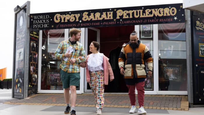 Rosie Jones leave the Gypsy Sarah Petulengro reading with comedian Gus Khan and the series director Tom Levin