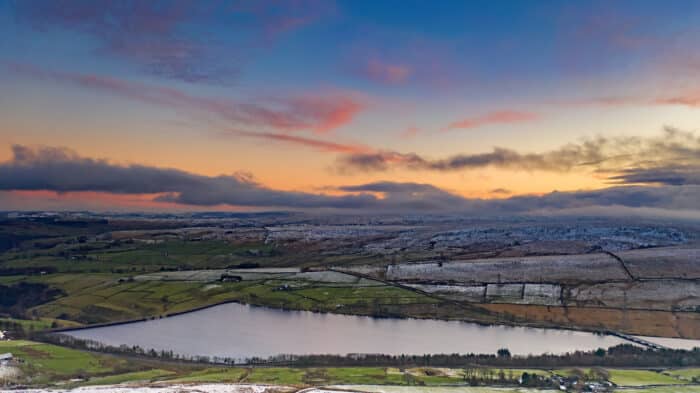 Baitings reservoir is set high in the hills above Ripponden in Calderdale West Yorkshire, surrounded by green fields and