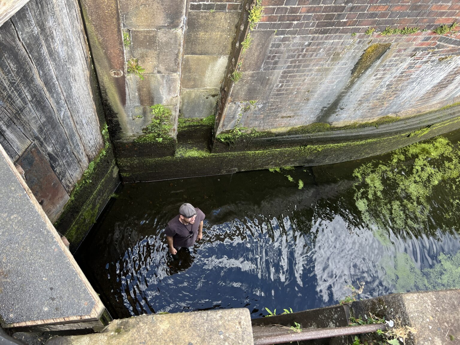 Robbie Cumming in the canal lock looking for his phone, Canal Boat Diaries