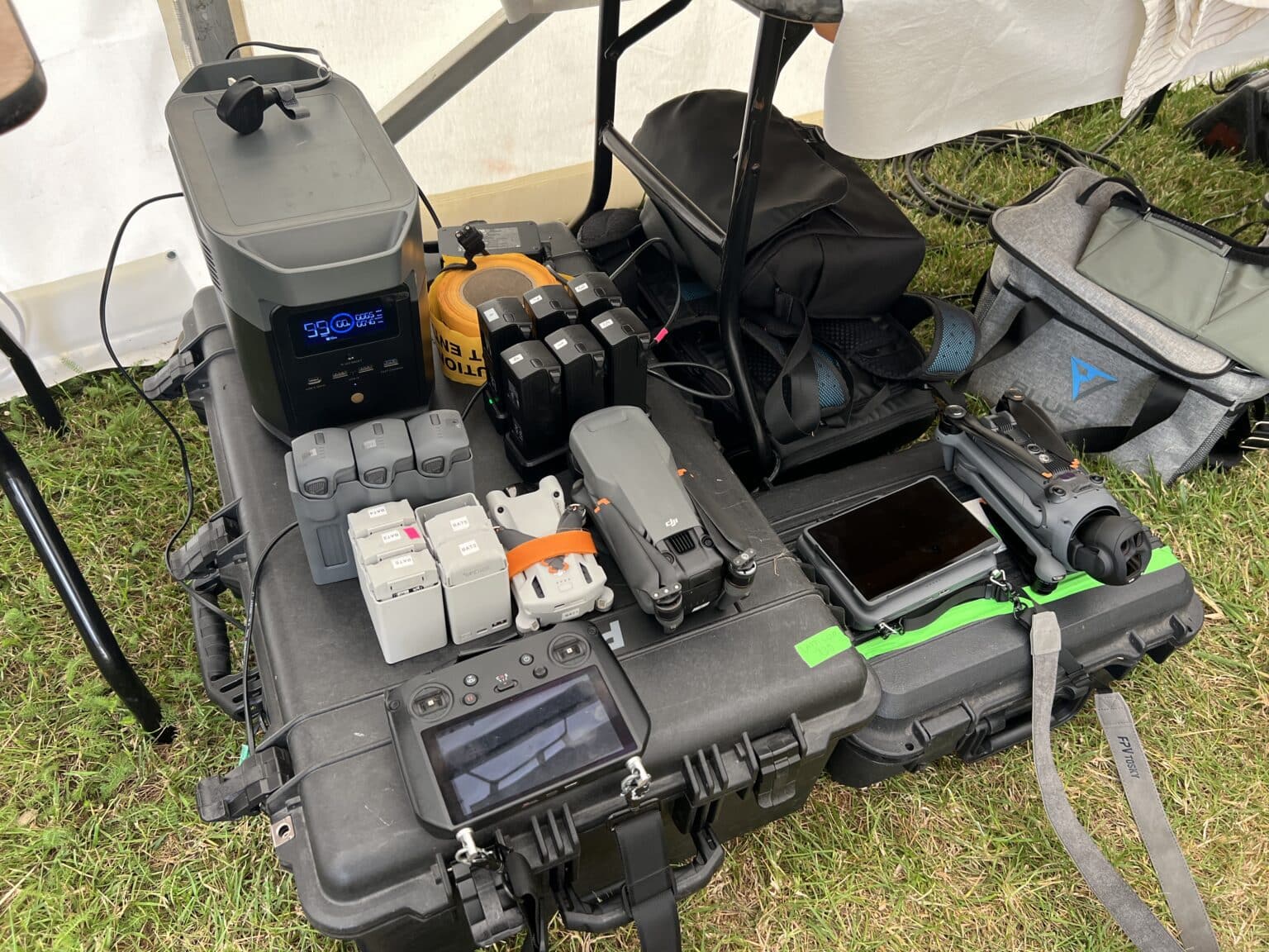 Drone kit, batteries and monitors at the drone base